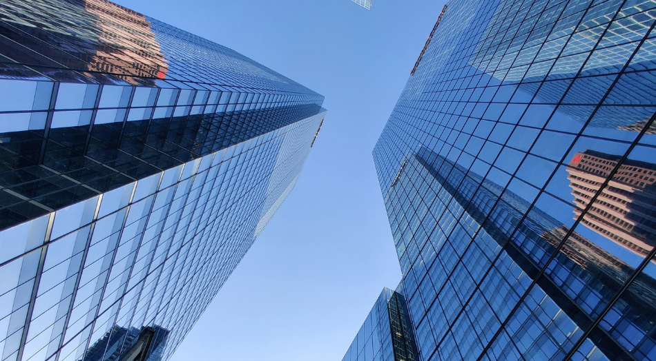 Glass kyscrapers from ground view.